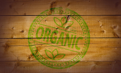 Organic stamp on wooden background