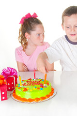 Boy bothering birthday girl