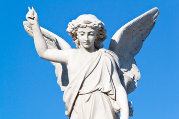 Beautiful angel with a blue sky background