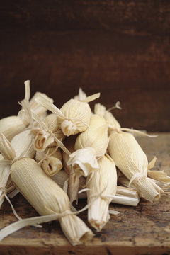 Stack of wrapped corn tamales