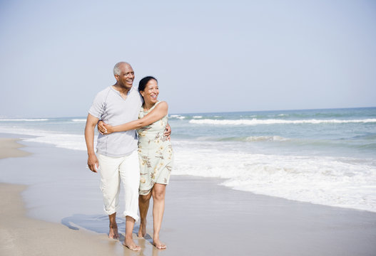 Black couple enjoying beach together