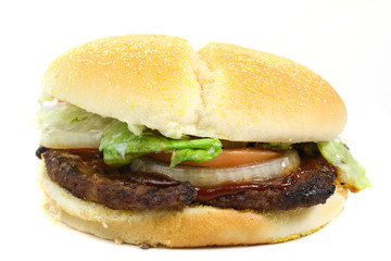 Hamburger with lettuce, tomato and onion isolated on white