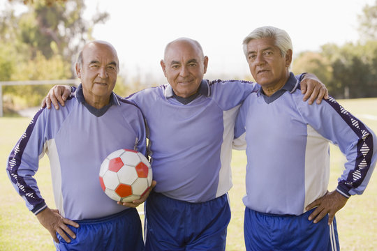 Fototapeta Senior Chilean soccer players standing together