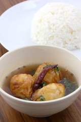 Thai food boiled egg fried with tamarind sauce and rice in wood