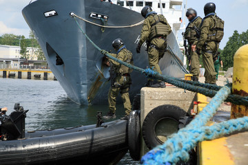 Soldiers marines  boarding a ship in a simulated assault