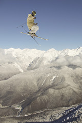 flying skier on mountains, extreme sport