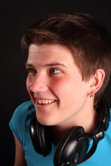 A young boy listening to music