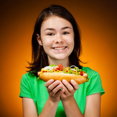 Girl eating big sandwich