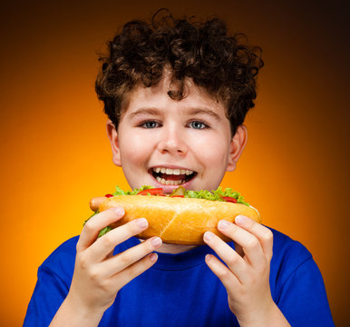 Boy Eating Big Sandwich