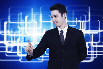 business man pressing a touchscreen button
