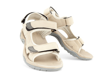 Travel female sandals over white background