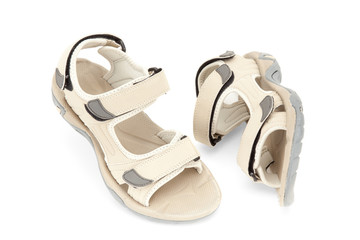 Travel female sandals over white background