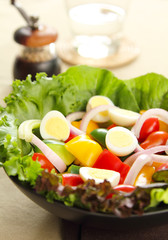 Healthy salad with quail eggs