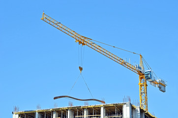 Building crane and reinforcement on construction site