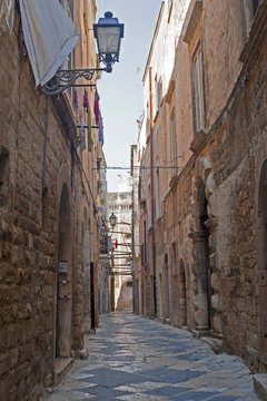 Fototapeta Bisceglie (Apulia, Italy) - Old street and cathedral