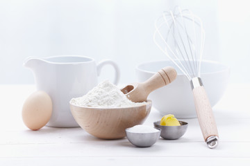 ingredients and tools to make a cake, flour, butter, sugar,eggs