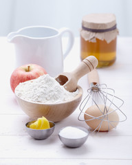 ingredients and tools to make a cake, flour, butter, sugar,eggs