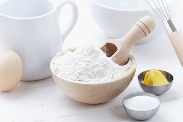 ingredients and tools to make a cake, flour, butter, sugar,eggs