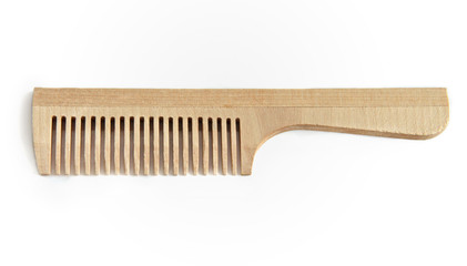 Wooden comb on a white background