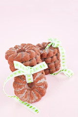 Delicious chocolate cookies on pink background.