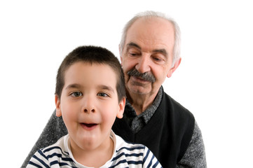 Cute boy with his grandfather isolated on white background.
