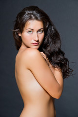 Fototapeta premium Young dark haired beautiful woman topless