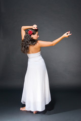 Fototapeta premium Dancing young dark haired beautiful woman