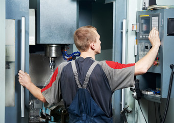 worker at machining tool workshop