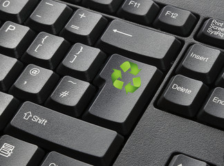 A Black Keyboard With Recycle Key