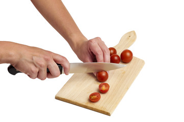Using kitchen knife to cut tomato