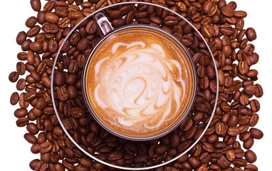 The cap of black coffee standing on grains