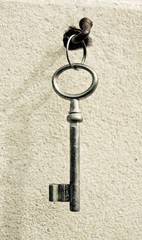 key on an old nail clogged at the wall