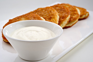 Potato pancakes with sour cream