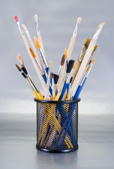 Set of art tools on a chrome background.