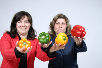 Fototapeta na wymiar woman with colored peppers, healthy food photo
