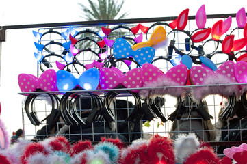 A stand in the street selling funny illuminated hairslides