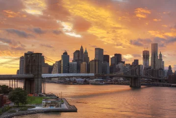 Photo sur Aluminium New York Manhattan Skyline with a Fiery Cloudscape