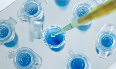 Scientific depositing a sample in a tube