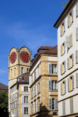 Fototapeta na wymiar Clock tower in the old town of Neuchatel, Switzerland
