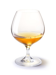 cognac glass with gold cognac on a white with shadow