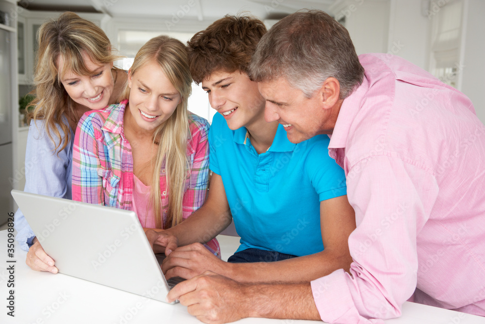 Wall mural family using laptop