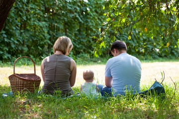 Fototapeta premium Family having picnic in park