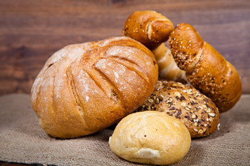 Composition of fresh bread on wood