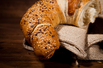 Composition of fresh bread on wood
