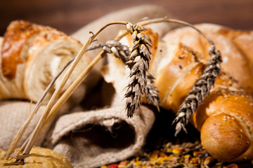 Composition of fresh bread on wood