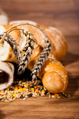 Composition of fresh bread on wood