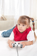 Happy child playing a video game