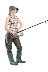 Full length portrait of a woman holding a fishing pole