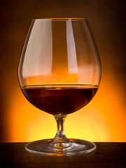 glass  of liquor on wood table