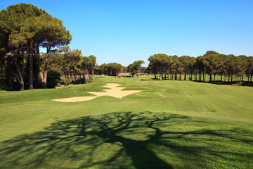 Golf course with sand trap.